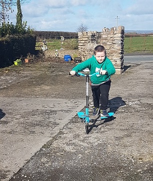 Riley on his scooter